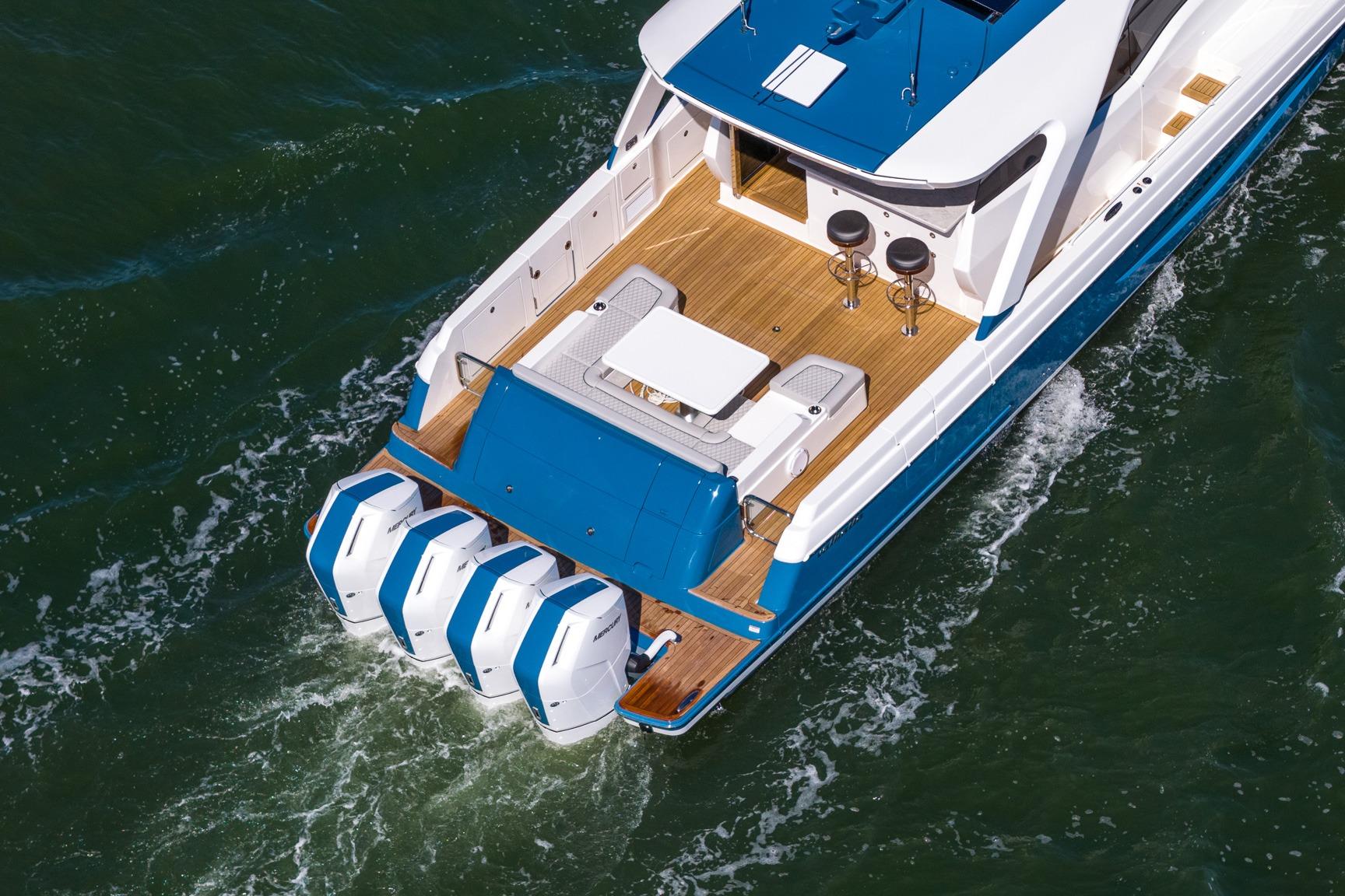 2026 Valhalla Boatworks V-55 Sport Yacht cruising on water, showcasing sleek design and powerful engines.