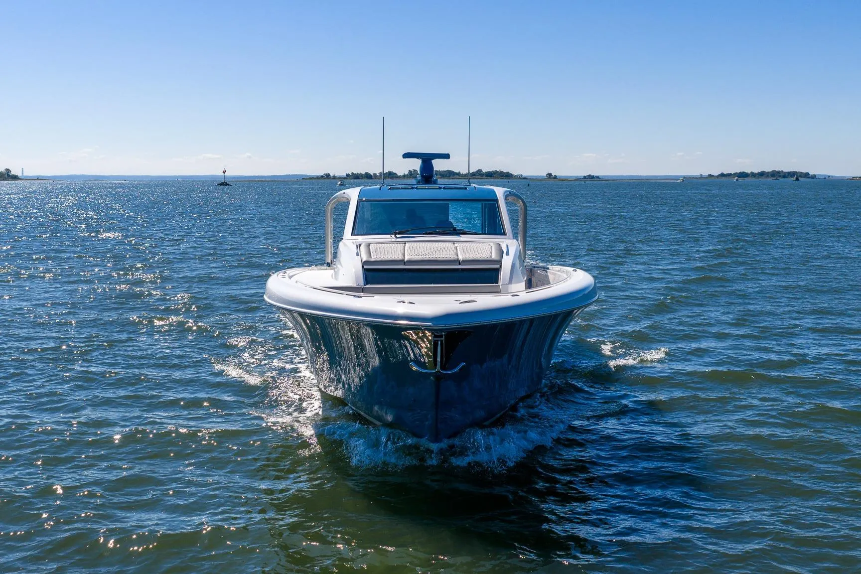 2026 Valhalla Boatworks V-55 Sport Yacht cruising on open water under clear skies.