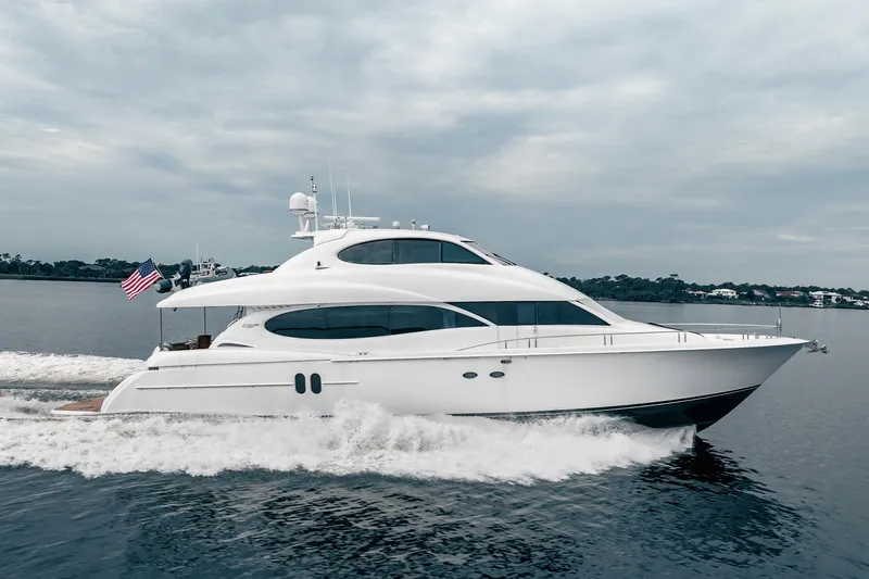 Water Ranch Yacht Photos Pics Luxury 2003 Lazzara 80 EB yacht cruising on calm waters under cloudy skies.