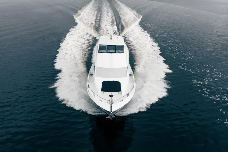 Water Ranch Yacht Photos Pics 2003 Lazzara 80 EB yacht cruising on open water, aerial view.