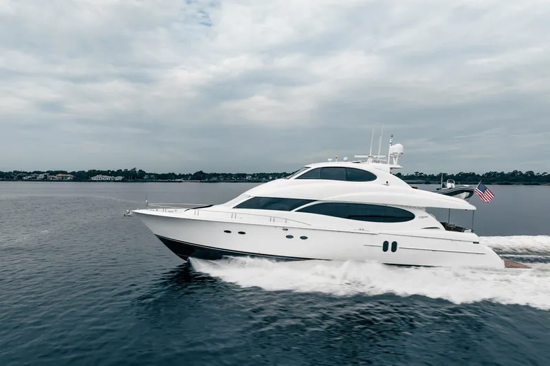 Water Ranch Yacht Photos Pics 2003 Lazzara 80 EB yacht cruising on open water under cloudy skies.