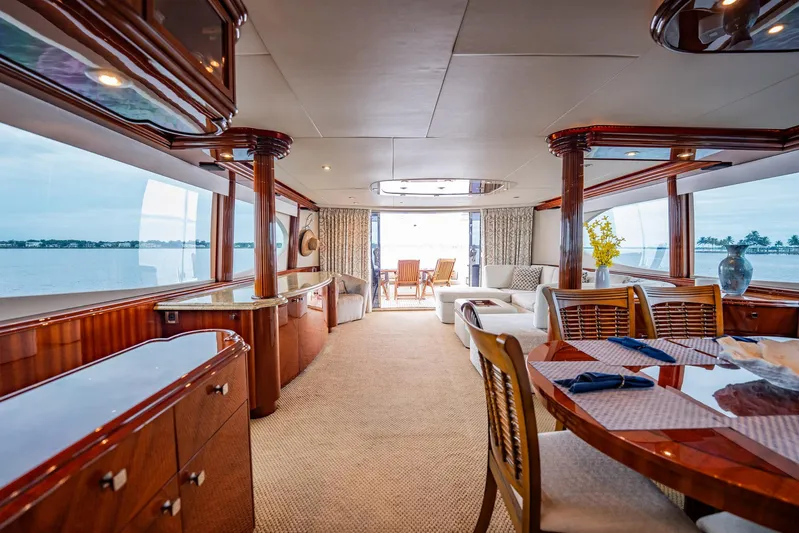 Water Ranch Yacht Photos Pics Luxurious interior of 2003 Lazzara 80 EB yacht with elegant wood finishes and ocean view.