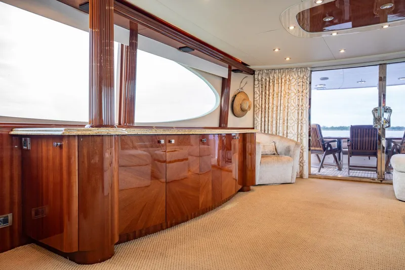 Water Ranch Yacht Photos Pics Luxurious interior of 2003 Lazzara 80 EB yacht with polished wood and elegant seating.