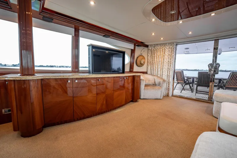 Water Ranch Yacht Photos Pics Luxurious interior of 2003 Lazzara 80 EB yacht with elegant wood finishes and spacious seating.