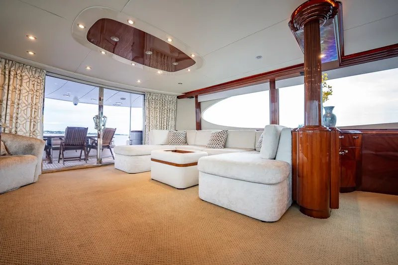 Water Ranch Yacht Photos Pics Luxurious interior of 2003 Lazzara 80 EB yacht with elegant seating and wooden accents.