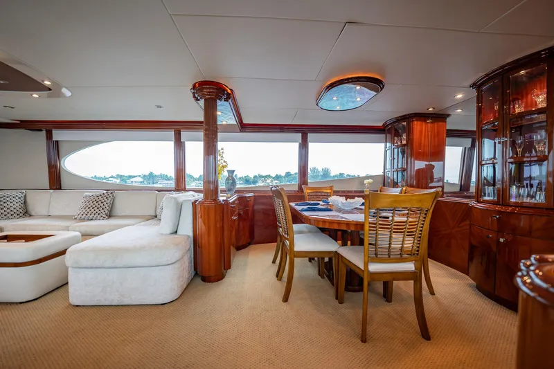 Water Ranch Yacht Photos Pics Luxurious interior of 2003 Lazzara 80 EB yacht with elegant dining and seating area.