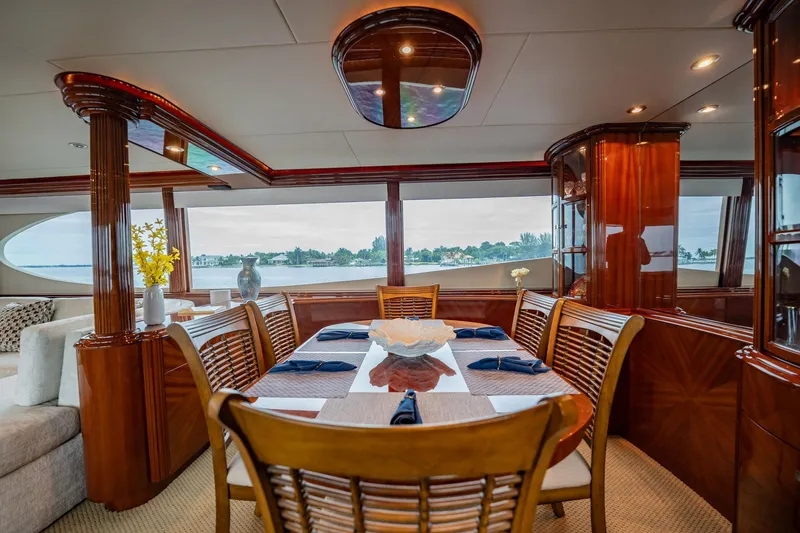 Water Ranch Yacht Photos Pics Luxurious interior of 2003 Lazzara 80 EB yacht with elegant dining area and panoramic windows.