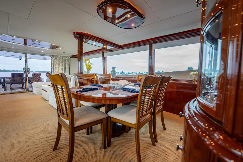 Water Ranch Yacht Photos Pics Luxurious interior of 2003 Lazzara 80 EB yacht with elegant dining area and panoramic windows.