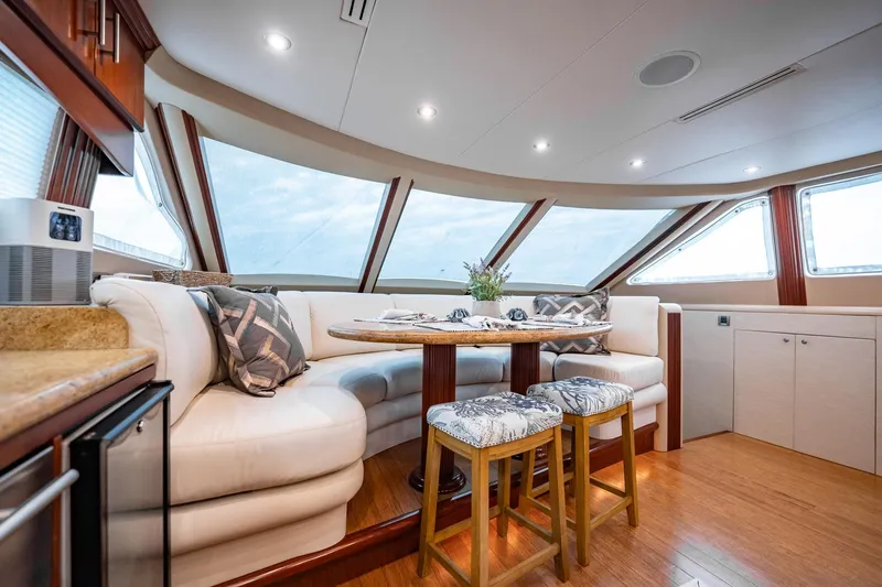 Water Ranch Yacht Photos Pics Luxurious interior of 2003 Lazzara 80 EB yacht with elegant seating and dining area.