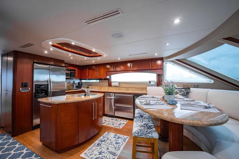 Water Ranch Yacht Photos Pics Luxurious 2003 Lazzara 80 EB yacht interior with modern kitchen and elegant dining area.