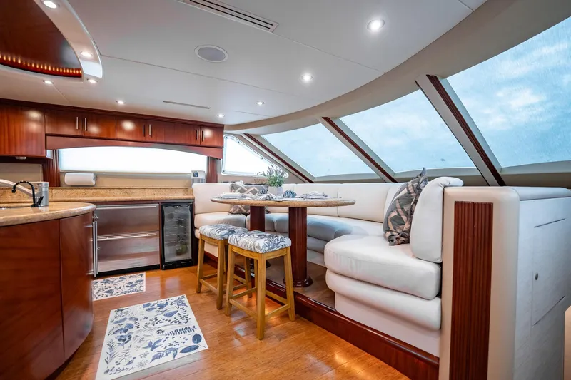 Water Ranch Yacht Photos Pics Luxurious interior of 2003 Lazzara 80 EB yacht with elegant seating and modern kitchen.