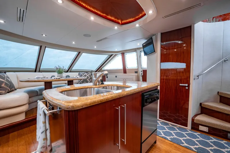 Water Ranch Yacht Photos Pics Luxurious interior of 2003 Lazzara 80 EB yacht with modern kitchen and seating area.