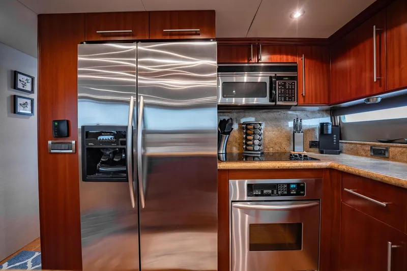 Water Ranch Yacht Photos Pics Luxurious kitchen in 2003 Lazzara 80 EB yacht with stainless steel appliances.