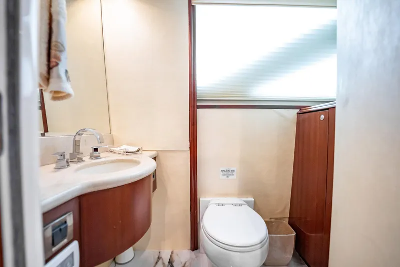 Water Ranch Yacht Photos Pics Luxurious bathroom in 2003 Lazzara 80 EB yacht with modern fixtures and elegant design.