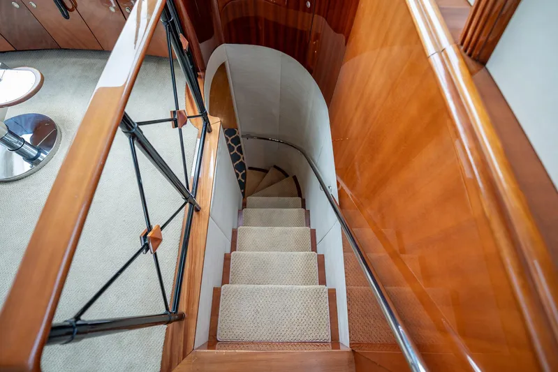 Water Ranch Yacht Photos Pics Staircase with wooden railing inside 2003 Lazzara 80 EB yacht, featuring elegant design.