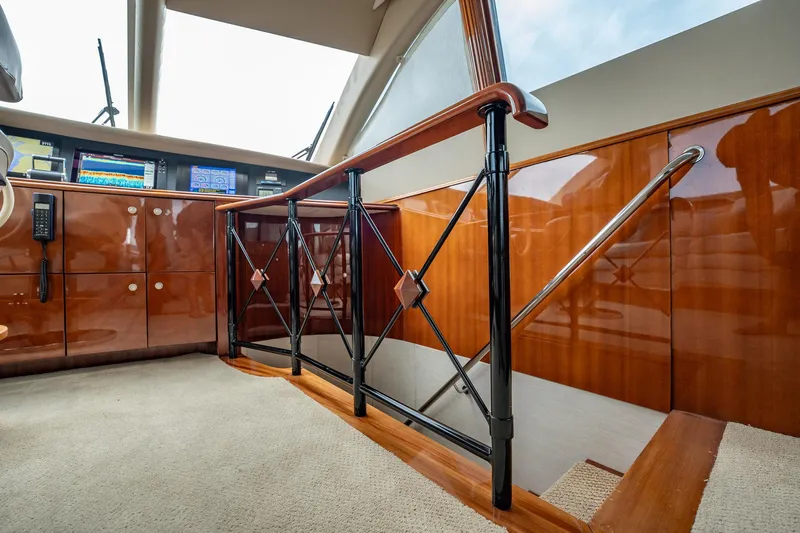 Water Ranch Yacht Photos Pics Interior of 2003 Lazzara 80 EB yacht with polished wood and modern navigation equipment.