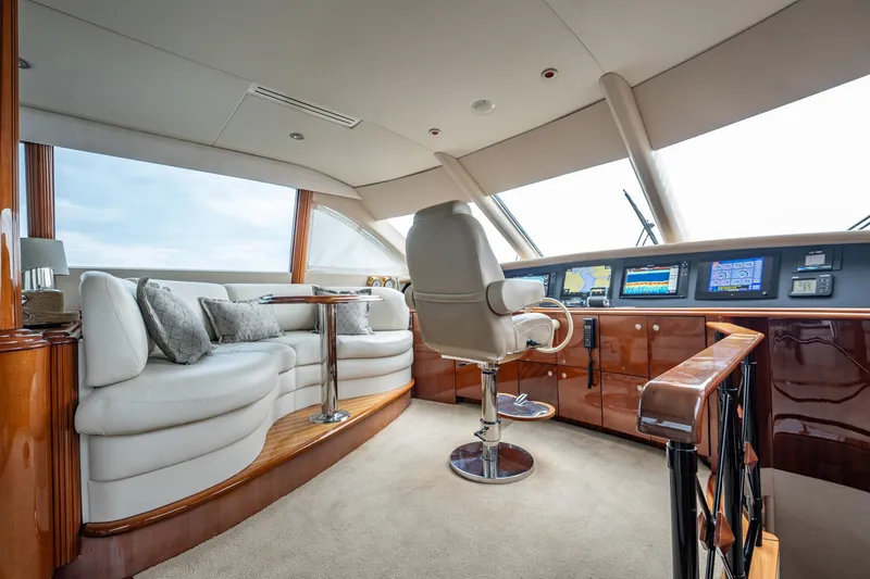 Water Ranch Yacht Photos Pics Luxurious interior of 2003 Lazzara 80 EB yacht with plush seating and modern navigation controls.