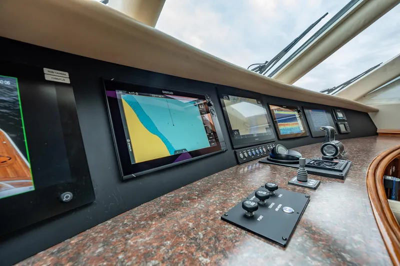 Water Ranch Yacht Photos Pics Control panel of 2003 Lazzara 80 EB yacht with navigation screens and controls.