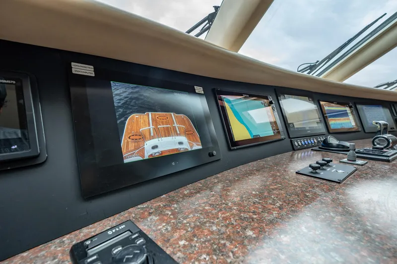 Water Ranch Yacht Photos Pics Control panel of 2003 Lazzara 80 EB yacht with multiple navigation screens.