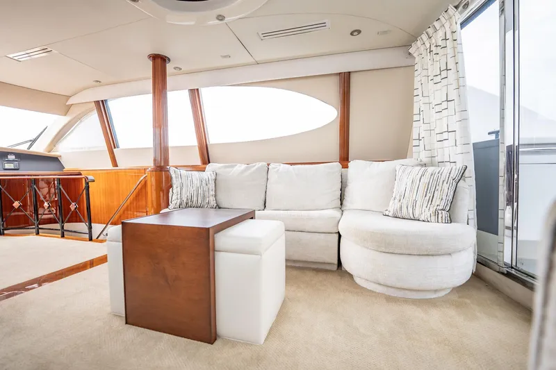 Water Ranch Yacht Photos Pics Luxurious interior of 2003 Lazzara 80 EB yacht with plush seating and elegant decor.