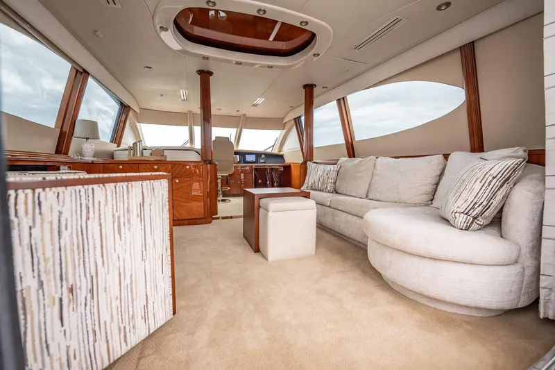 Water Ranch Yacht Photos Pics Luxurious interior of 2003 Lazzara 80 EB yacht with plush seating and elegant wood finishes.