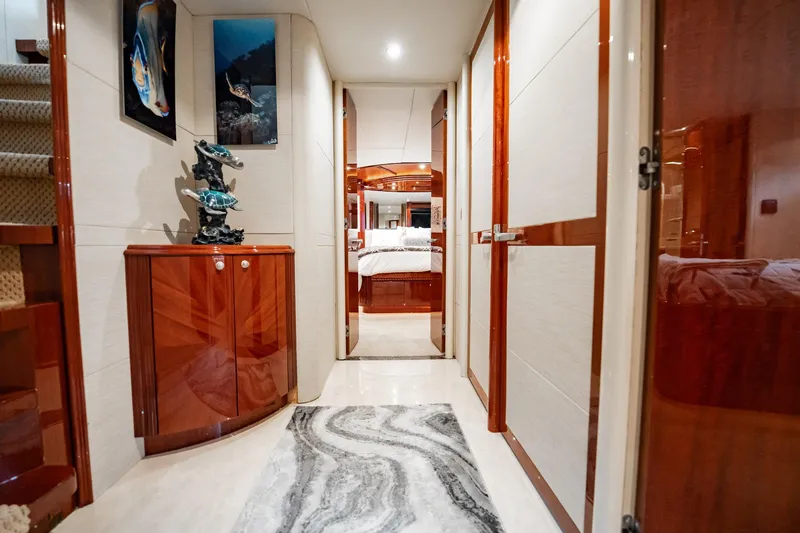 Water Ranch Yacht Photos Pics Luxurious interior hallway of 2003 Lazzara 80 EB yacht with elegant decor and artwork.