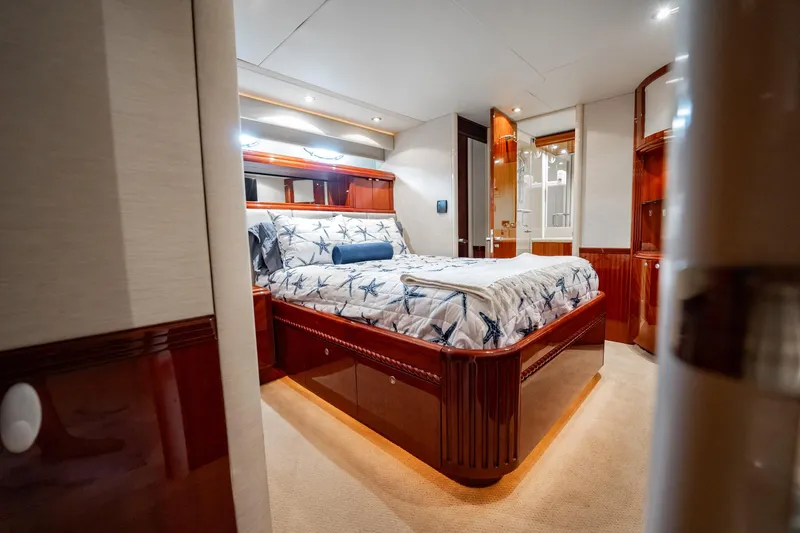 Water Ranch Yacht Photos Pics Luxurious bedroom interior of 2003 Lazzara 80 EB yacht with elegant wood finishes.