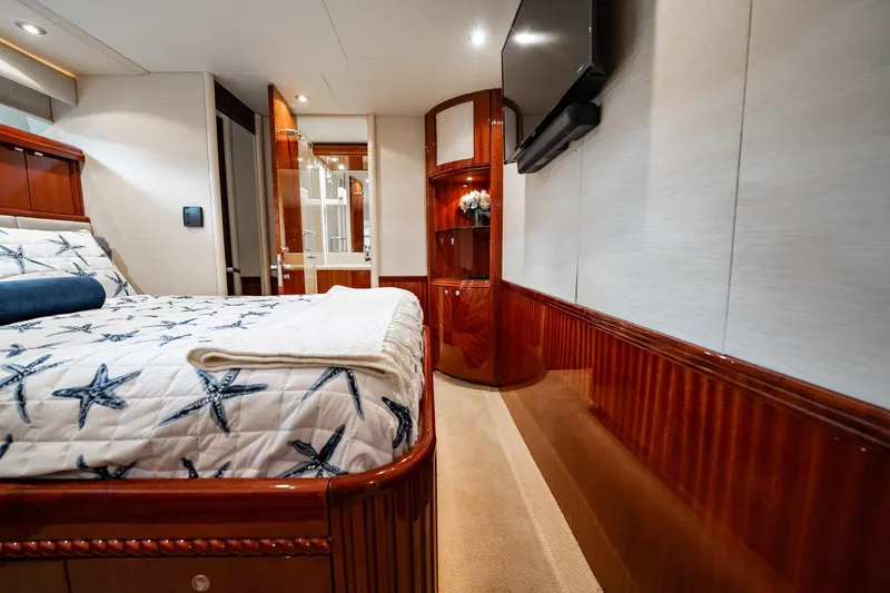 Water Ranch Yacht Photos Pics Luxurious bedroom interior of 2003 Lazzara 80 EB yacht with starfish-themed bedding.