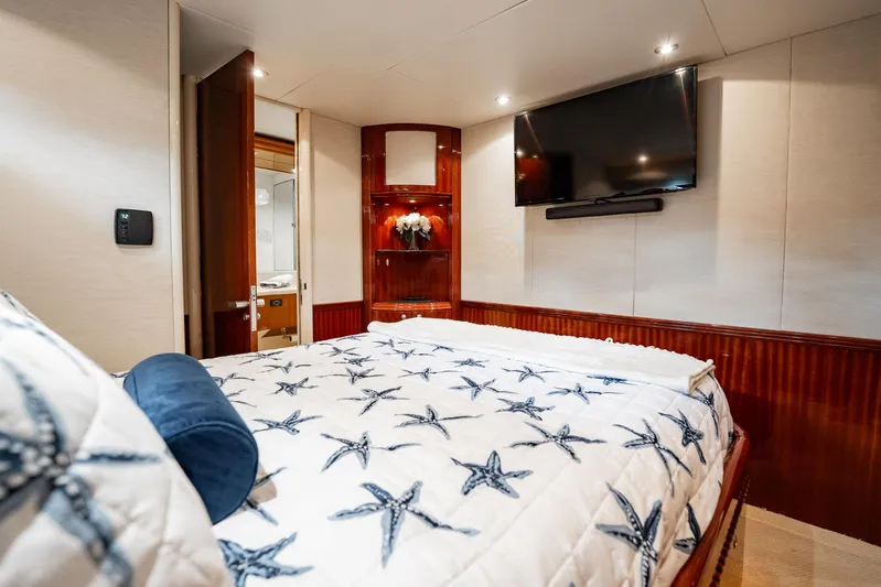 Water Ranch Yacht Photos Pics Luxurious bedroom interior of 2003 Lazzara 80 EB yacht with starfish-themed bedding.