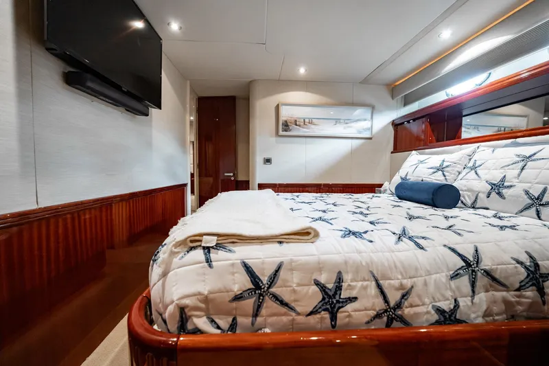 Water Ranch Yacht Photos Pics Luxurious bedroom interior on 2003 Lazzara 80 EB yacht with starfish-themed bedding.