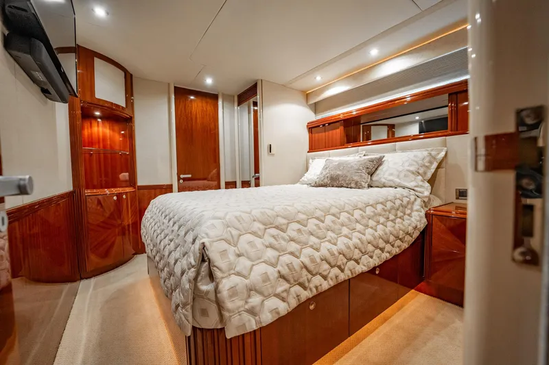 Water Ranch Yacht Photos Pics Luxurious bedroom interior of 2003 Lazzara 80 EB yacht with elegant wood finishes.