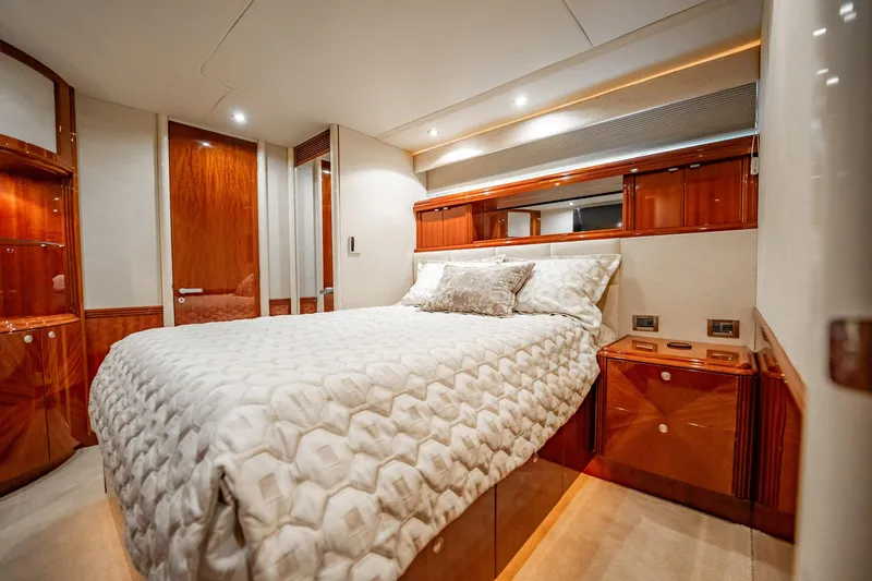 Water Ranch Yacht Photos Pics Luxurious bedroom interior of 2003 Lazzara 80 EB yacht with elegant wood finishes.