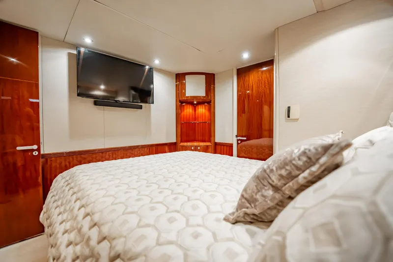 Water Ranch Yacht Photos Pics Luxurious bedroom interior on 2003 Lazzara 80 EB yacht with TV and elegant bedding.