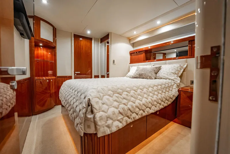 Water Ranch Yacht Photos Pics Luxurious bedroom interior of 2003 Lazzara 80 EB yacht with elegant wood finishes.