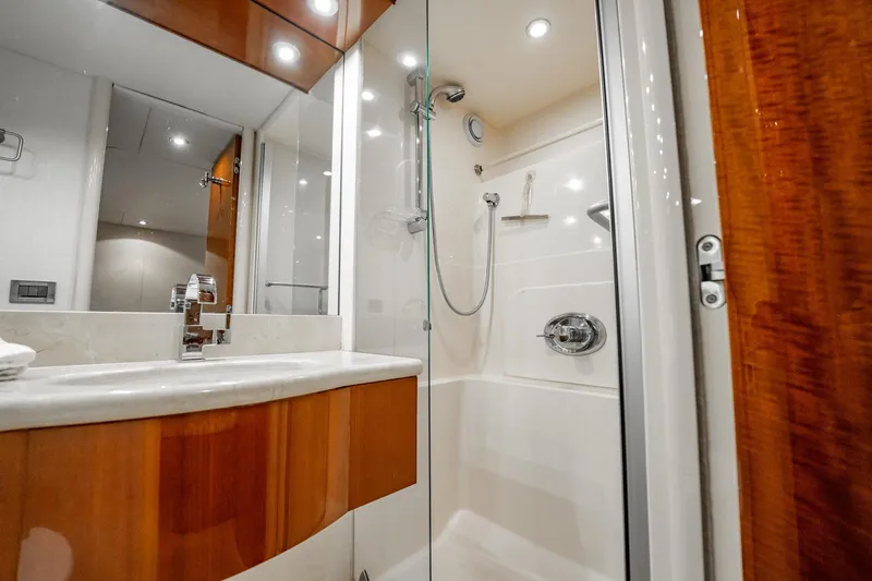 Water Ranch Yacht Photos Pics Luxurious bathroom in 2003 Lazzara 80 EB yacht with modern fixtures and elegant wood accents.