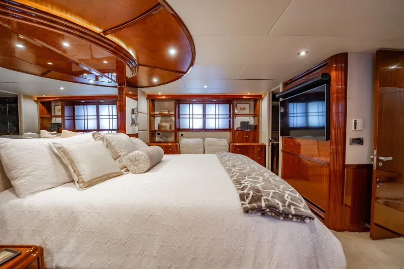 Water Ranch Yacht Photos Pics Luxurious bedroom interior of 2003 Lazzara 80 EB yacht with elegant wood finishes.