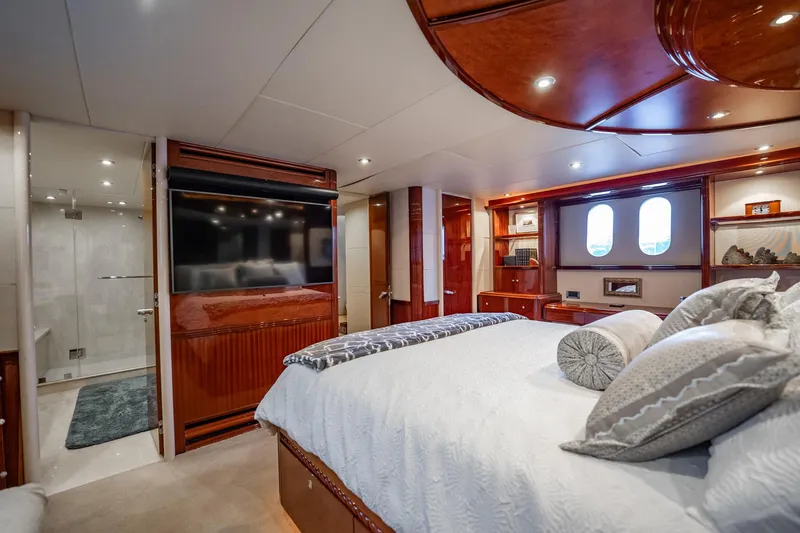 Water Ranch Yacht Photos Pics Luxurious bedroom interior of 2003 Lazzara 80 EB yacht with elegant wood finishes.
