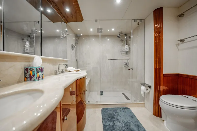 Water Ranch Yacht Photos Pics Luxurious bathroom in 2003 Lazzara 80 EB yacht with glass shower and elegant fixtures.