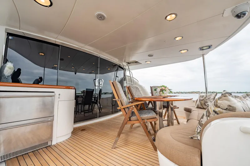 Water Ranch Yacht Photos Pics Luxurious 2003 Lazzara 80 EB yacht deck with elegant seating and dining area.