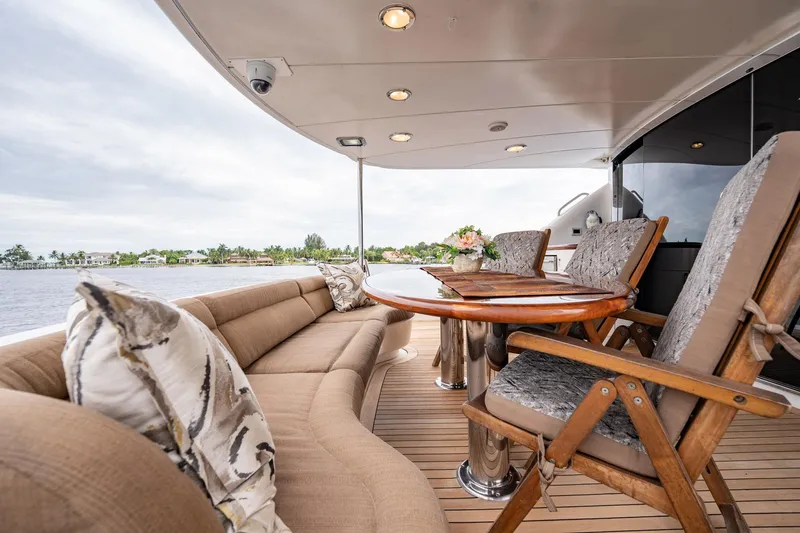 Water Ranch Yacht Photos Pics Luxurious 2003 Lazzara 80 EB yacht deck with elegant seating and scenic waterfront view.