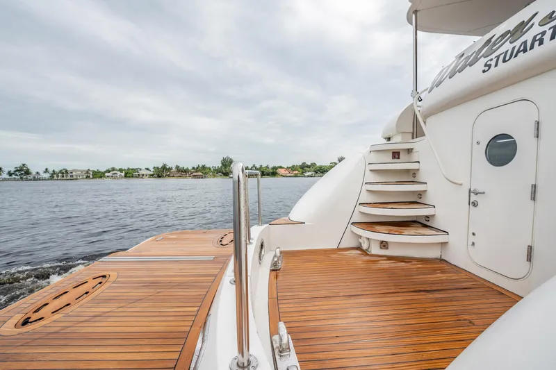 Water Ranch Yacht Photos Pics Luxury 2003 Lazzara 80 EB yacht deck with wooden flooring and elegant staircase.