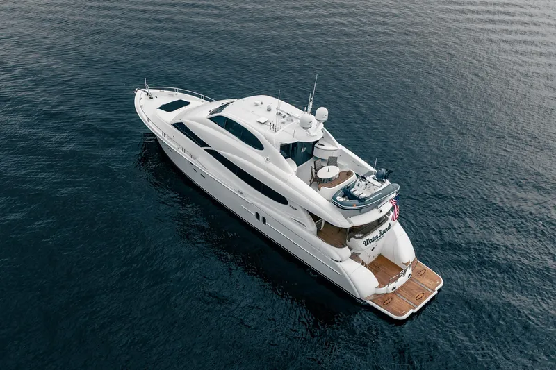 Water Ranch Yacht Photos Pics Luxurious 2003 Lazzara 80 EB yacht cruising on calm waters, aerial view.