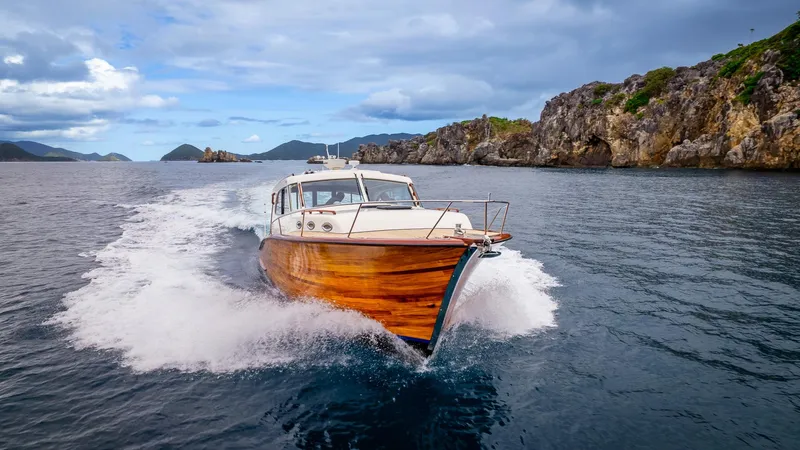 Trident Yacht Photos Pics Maverick Yachts Costa Rica 50 cruising near rocky coastline, 2015 model.