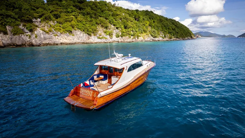 Trident Yacht Photos Pics Luxurious 2015 Maverick Yachts Costa Rica 50 cruising near a scenic coastline.