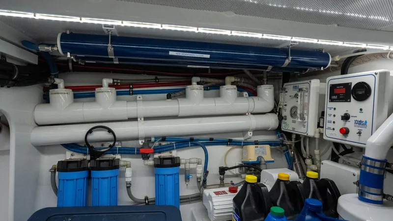 Trident Yacht Photos Pics Engine room of 2015 Maverick Yachts Costa Rica 50, featuring pipes and control systems.