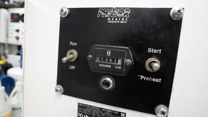 Trident Yacht Photos Pics Control panel of a 2015 Maverick Yachts Costa Rica 50, featuring hour meter and switches.