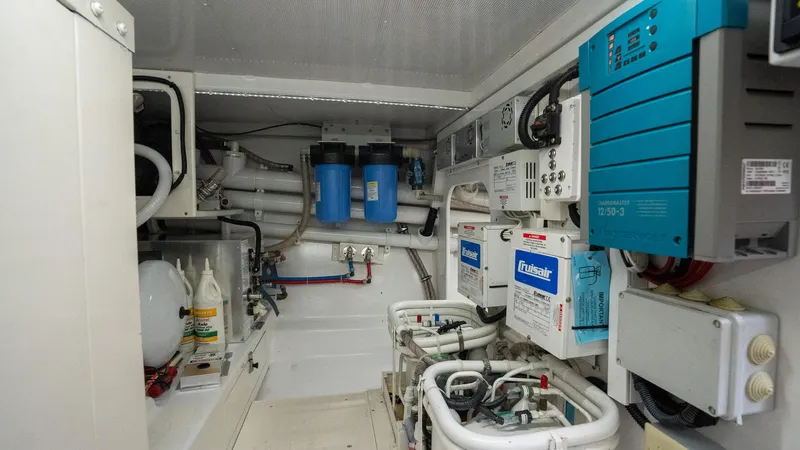 Trident Yacht Photos Pics Engine room of 2015 Maverick Yachts Costa Rica 50, featuring electrical and plumbing systems.