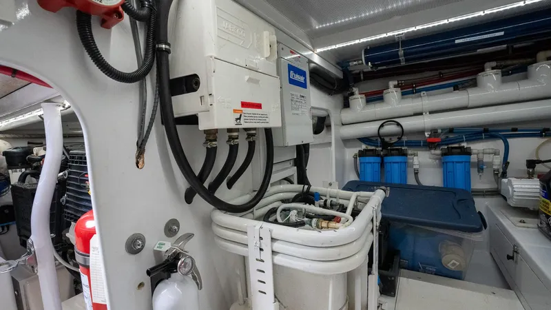 Trident Yacht Photos Pics Engine room of 2015 Maverick Yachts Costa Rica 50, featuring electrical and plumbing systems.