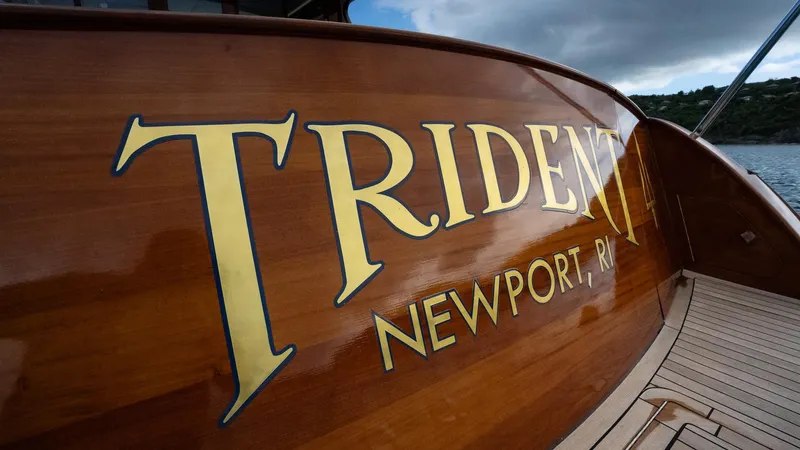 Trident Yacht Photos Pics Maverick Yachts Costa Rica 50, 2015 model, with "Trident Newport, RI" on wooden hull.