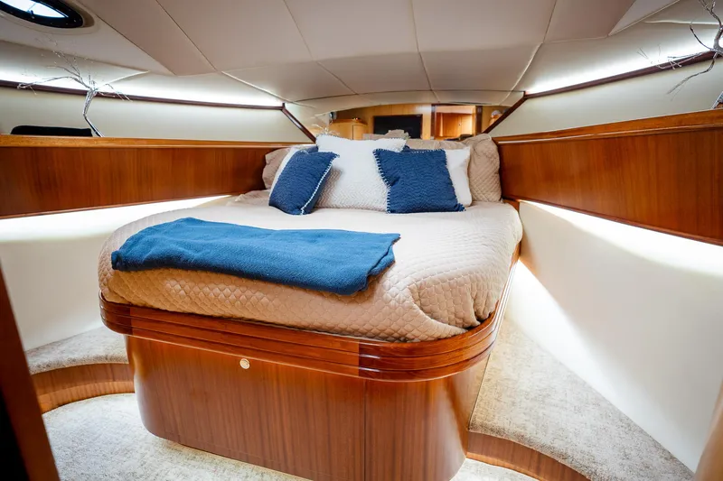 Trident Yacht Photos Pics Luxurious cabin interior of 2015 Maverick Yachts Costa Rica 50, featuring elegant wood finish.